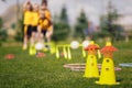 Sports training camp equipment for chldren. Young football players at summer practice camp Royalty Free Stock Photo