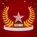 Sports trophy in the form of a star on red. Sports cup in the form of a glass star. Royalty Free Stock Photo