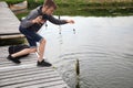 Sports trout fishing. Fisherman with fishing line.