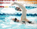 Sports, water splash or people training in swimming pool in a race competition, exercise or cardio workout. Swimmer Royalty Free Stock Photo