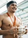 Sports winner, swimming trophy and happy man with competition success, fitness achievement and winning race. Happiness Royalty Free Stock Photo