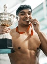 Sports winner, swimming trophy and man portrait with competition success, achievement goal and winning race. Medal Royalty Free Stock Photo