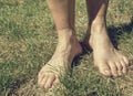 Sports woman dirty barefoot legs after run race. and sweaty skin