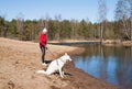 Sports woman with a dog Royalty Free Stock Photo