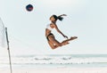 Sports woman jump at volleyball beach summer outdoor competition game on ocean or sea sand playing to win. Healthy Royalty Free Stock Photo