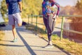 Sports woman and man getting ready to run and exercise outdoors Royalty Free Stock Photo