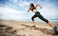 Sports woman running on seaside