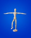 Sports wooden toy figure on blue