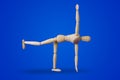 Sports wooden toy figure on blue