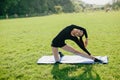 Sports and yoga girl sits on twine