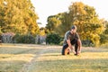 Sports and yoga. A man with a beard, in sportswear lacing sneakers before training. Copy space Royalty Free Stock Photo