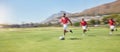 Sports, youth development and soccer players running on field with ball for game, goals and winning. Football, teamwork Royalty Free Stock Photo