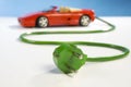 Sportscar and plug Royalty Free Stock Photo