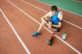 Sportsman with Artifitial Leg Sitting on Stadium