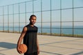 Sportsman with basketball ball on sports court Royalty Free Stock Photo