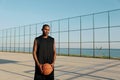 Sportsman with basketball ball on sports court Royalty Free Stock Photo