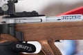 Sportsman biathlete aims rifle shooting. Selective focus, extreme close-up view shot. Biathlete in shooting area