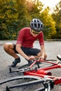 Sportsman bicycle cyclist repair parts and adjusting by himself on the road. outdoors