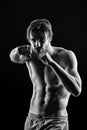 Sportsman in boxing position, sport. macho with fit bare fight with punch, fitness. Bearded man with six pack, knockout. Athl