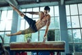 The sportsman during difficult exercise, sports gymnastics Royalty Free Stock Photo
