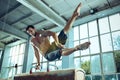 The sportsman during difficult exercise, sports gymnastics Royalty Free Stock Photo