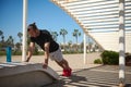 Sportsman doing push ups on stone bench during a bodyweight training in the city promenade