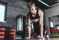 Sportsman doing on stepper pushups in aerobic fitness club. The handsome male is exercising his chest on the stepper in the modern Royalty Free Stock Photo