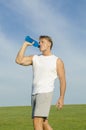 Sportsman drinking from water bottle. Royalty Free Stock Photo
