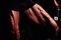 Sportsman in gym. Guy doing exercises. Closeup portrait of legs with veins. Male model with tanned skin. man Royalty Free Stock Photo