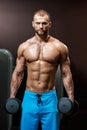 Sportsman holding dumbbells Royalty Free Stock Photo