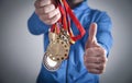 Sportsman holding medals. Sport, Winner, Success