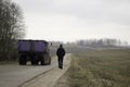 A sportsman is mooving away on a highway