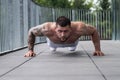 Sportsman muscular man workout in gym. Athletic man exercising with dumbbell. Fitness, sports concept, sport club Royalty Free Stock Photo