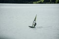 Sportsman people sailing windsurfing in Haidersee lake