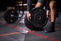 Fit sportsman powerlifter preparing for deadlift of barbell during competition Royalty Free Stock Photo