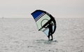 sportsman practices wingfoil, in the mediterranean sea. Royalty Free Stock Photo