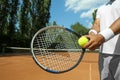 Sportsman preparing to serve tennis ball at court Royalty Free Stock Photo