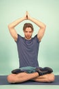 Sportsman relax in lotus pose. Man meditate on yoga mat. Fashion athlete practice yoga in gym. Meditation for body and Royalty Free Stock Photo