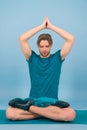 Sportsman relax in lotus pose. Man meditate on yoga mat. Fashion athlete practice yoga in gym. Meditation for body and Royalty Free Stock Photo