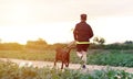 Sportsman running with his dog during phase 1 de- escalation of Coronavirus or Covid-19 in Spain. It is allowed running once a