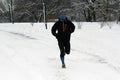 A sportsman runs on snow