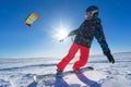 The sportsman on a snowboard runs kite Royalty Free Stock Photo