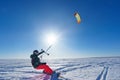 The sportsman on a snowboard runs kite Royalty Free Stock Photo