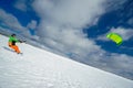 The sportsman on a snowboard runs kite Royalty Free Stock Photo