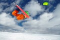 The sportsman on a snowboard runs kite Royalty Free Stock Photo