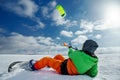 The sportsman on a snowboard runs kite Royalty Free Stock Photo