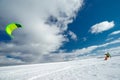 The sportsman on a snowboard runs kite Royalty Free Stock Photo