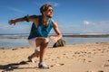 sportsman in sunglasses doing lunges on beach