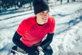 Sportsman Taking Break From Running in Extreme Snow Conditio