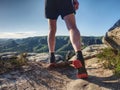 Slim man in yellow jersey, black shorts and running shoes run Royalty Free Stock Photo